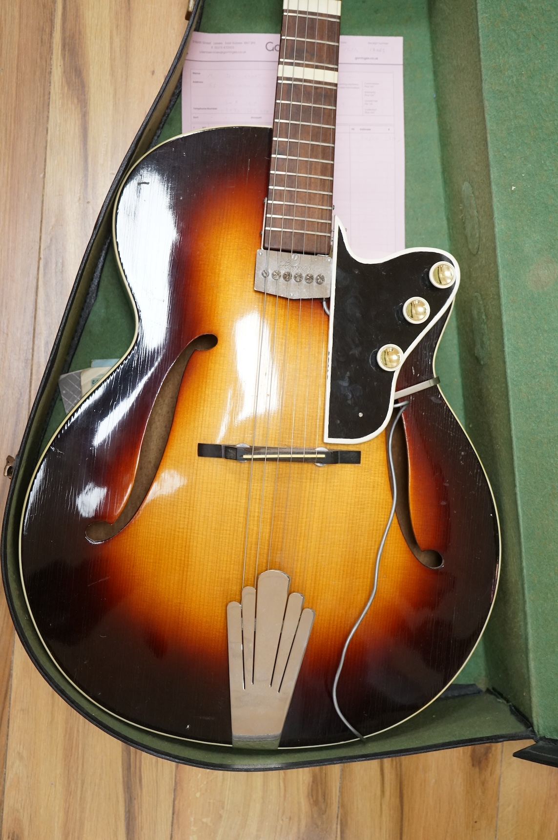 A 1950's Hofner style cut-away acoustic guitar, fitted with a pick up bearing Hofner engraved signature, with hard case.